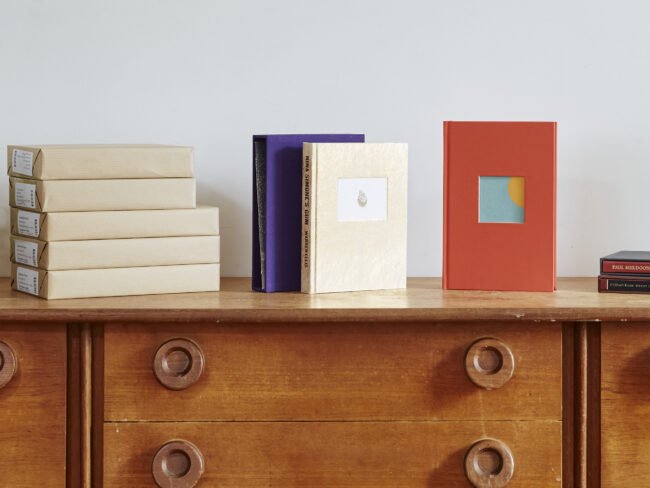 Faber books arranged on sideboard