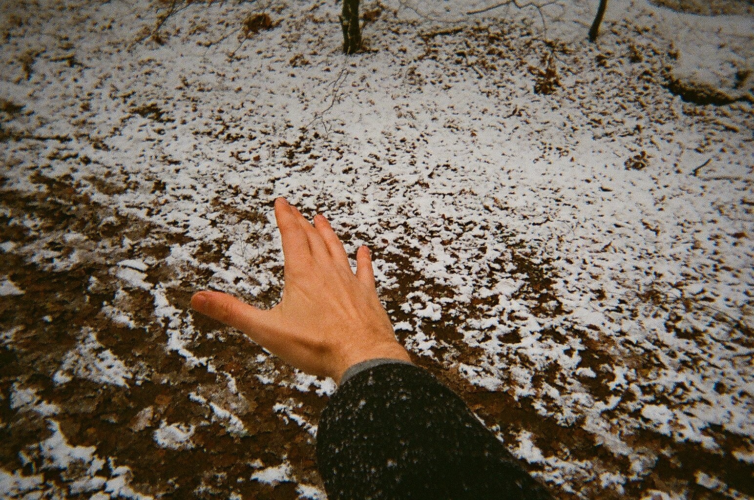 Hand floating above snow