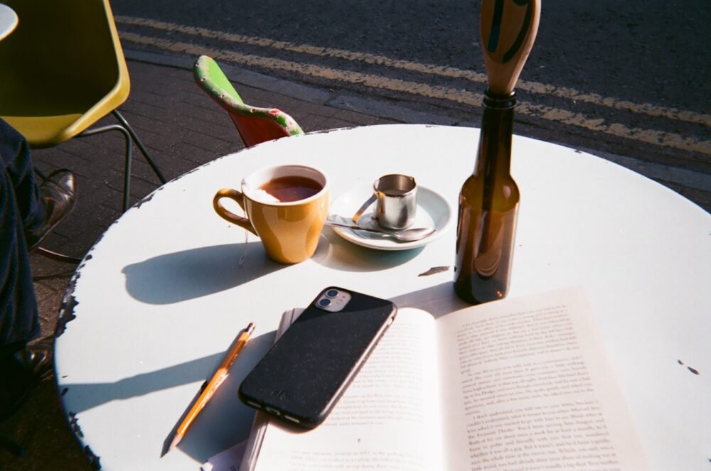 Coffee and a book on a table
