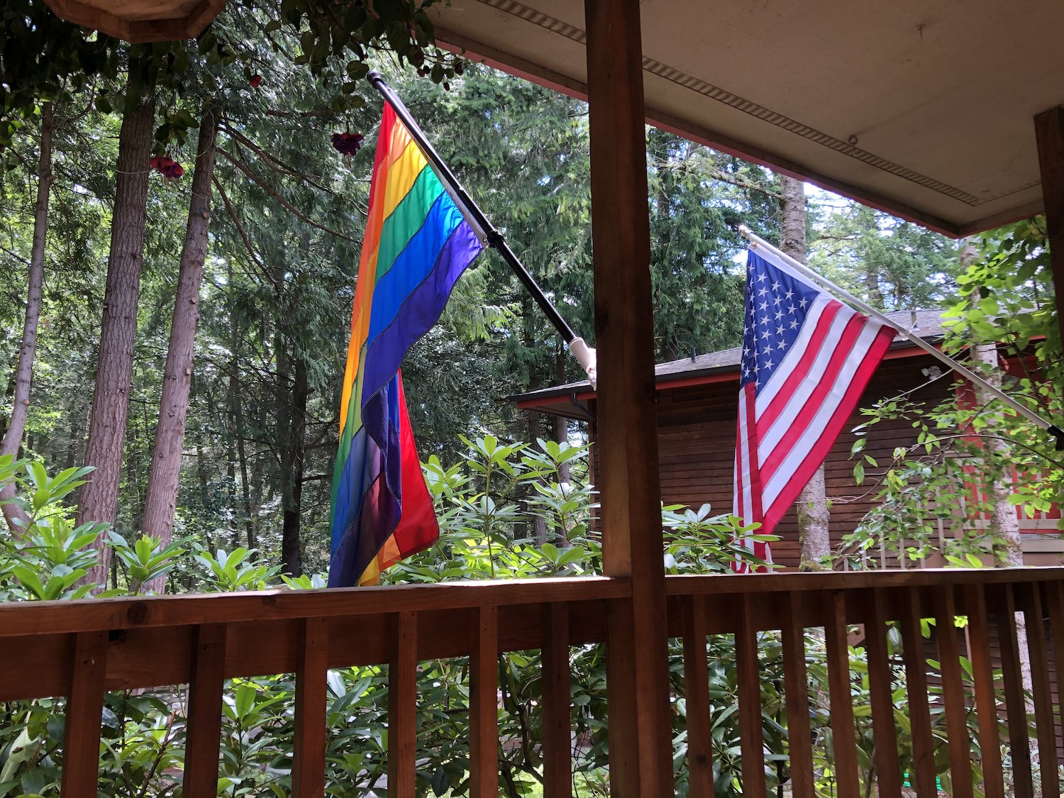Pride and USA flag hanging outside cabin